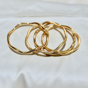 Sets - 4 gold plated Zigzag bangles